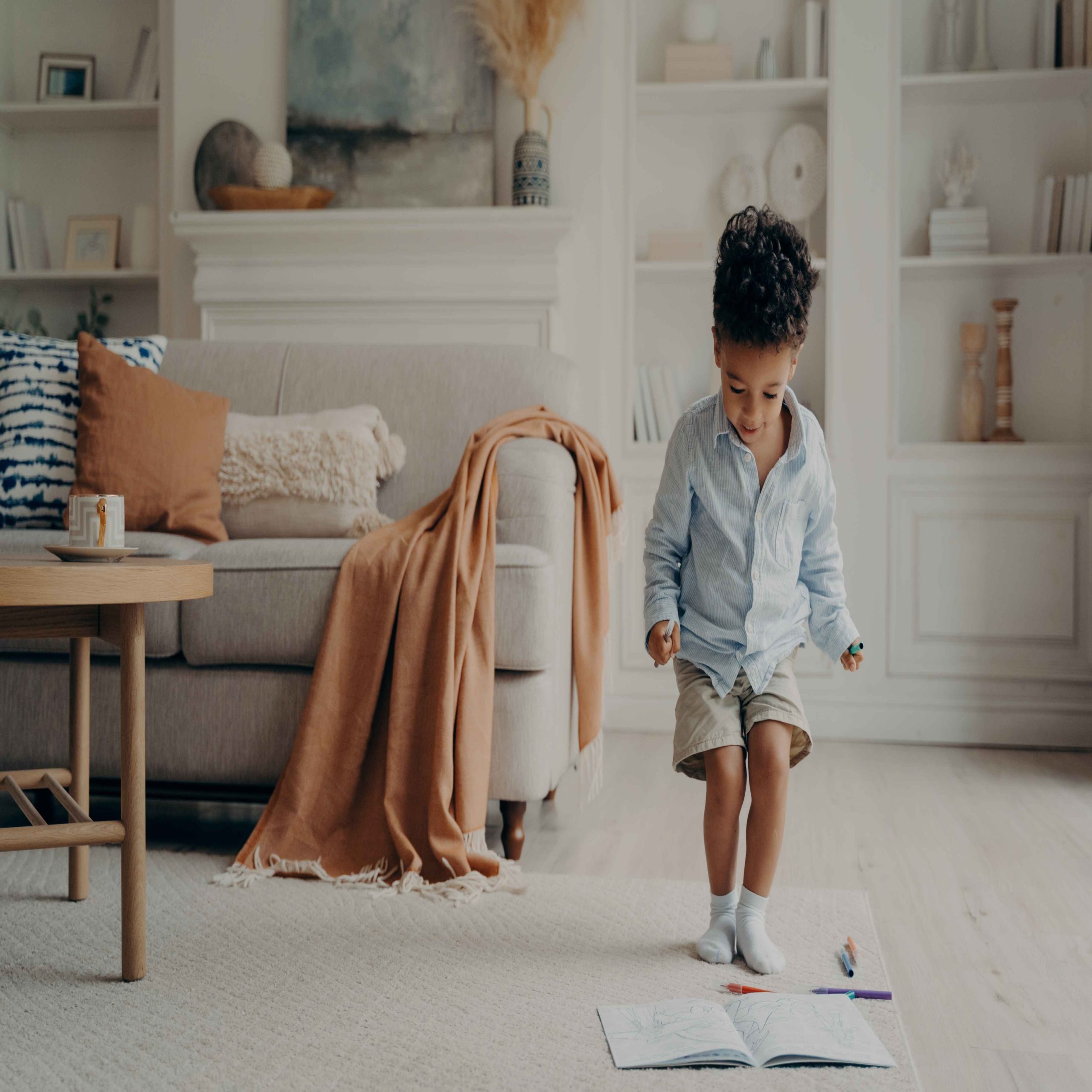 little boy in a clean organized room