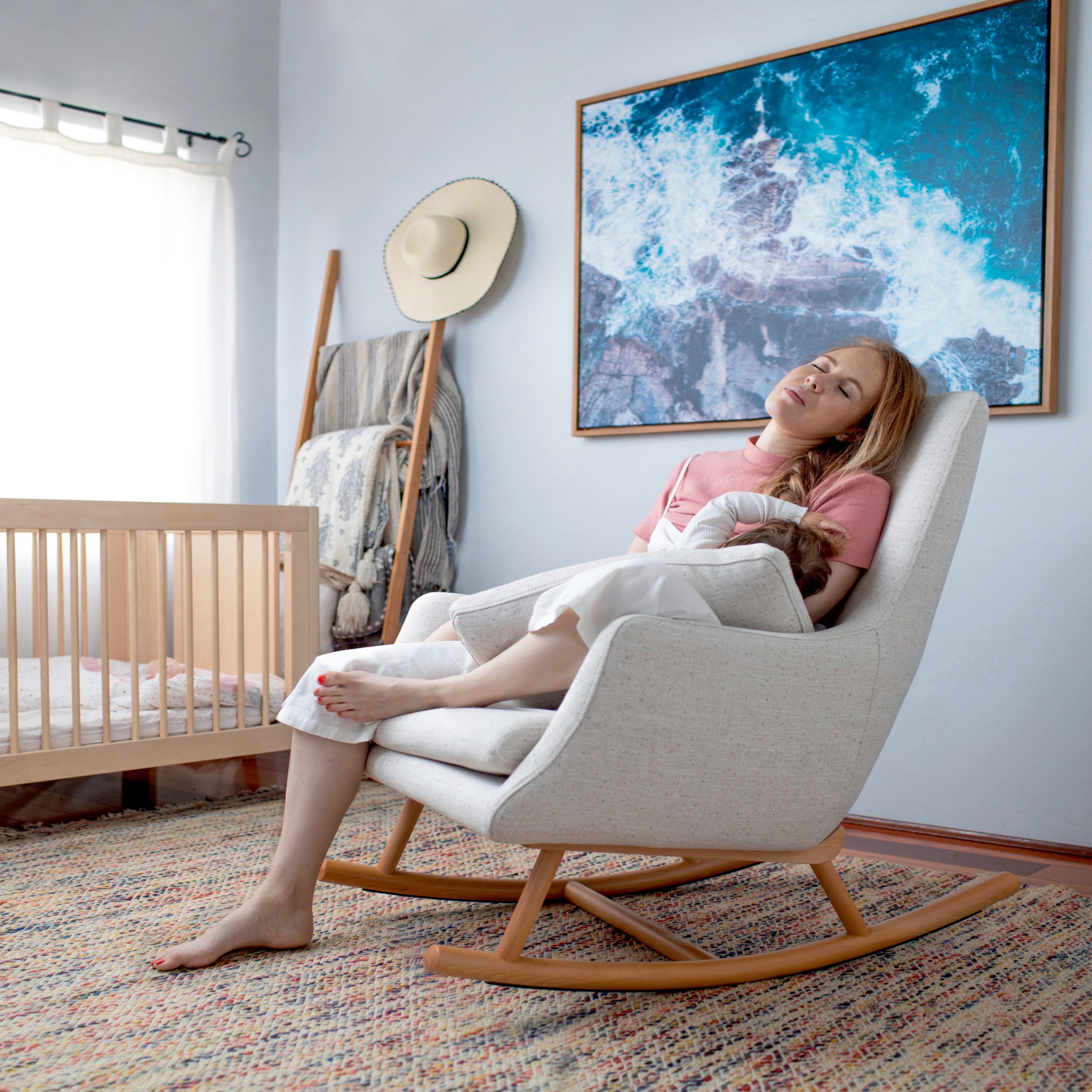 new mom and baby in glider chair