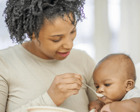 mom feeding baby food